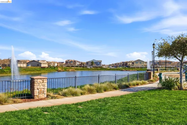 a view of a lake with a garden and lake view