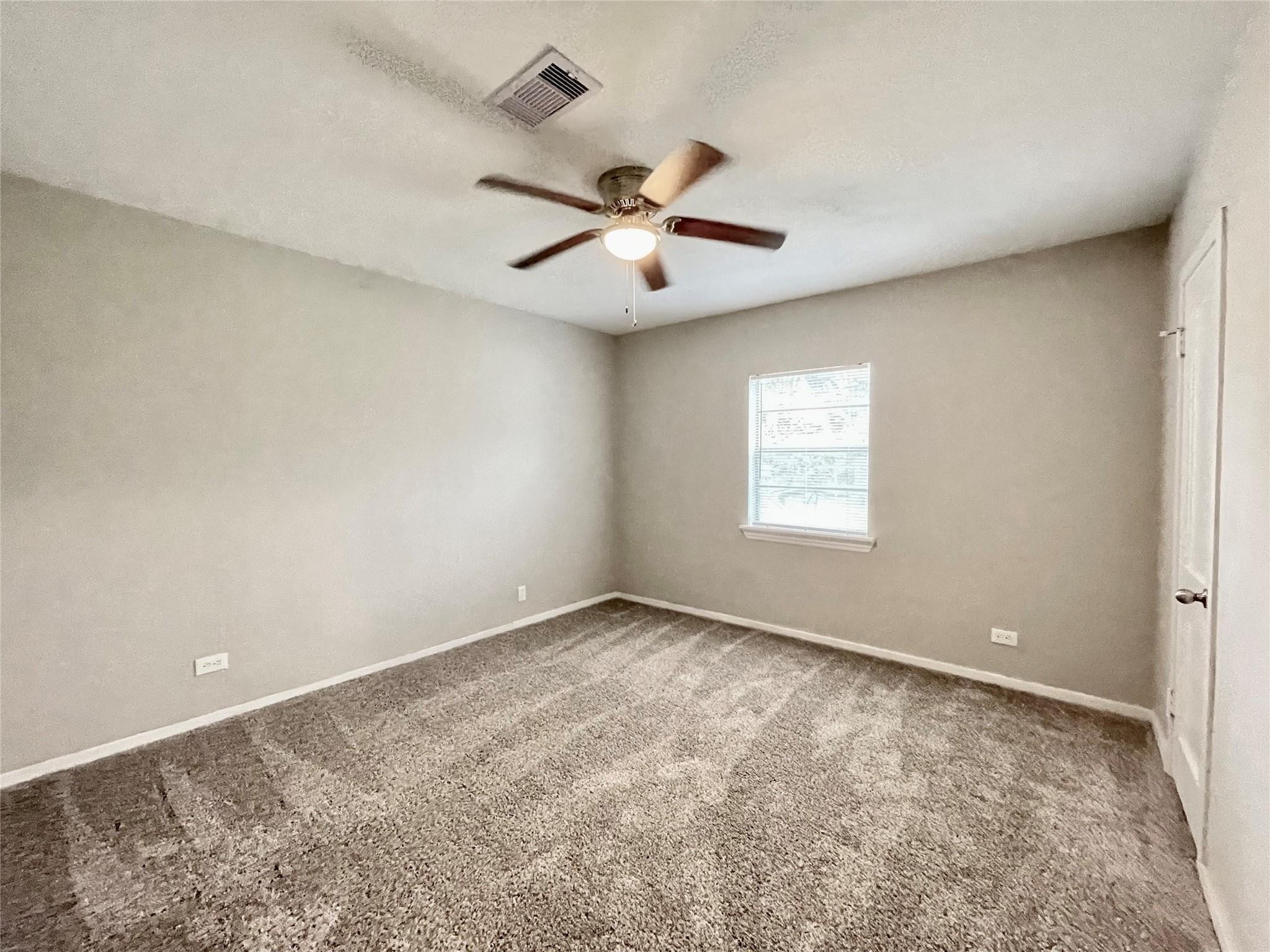 1827 Neuman La Marque, TX 77568 - Photo 15 of 24 a view of an empty room with a window