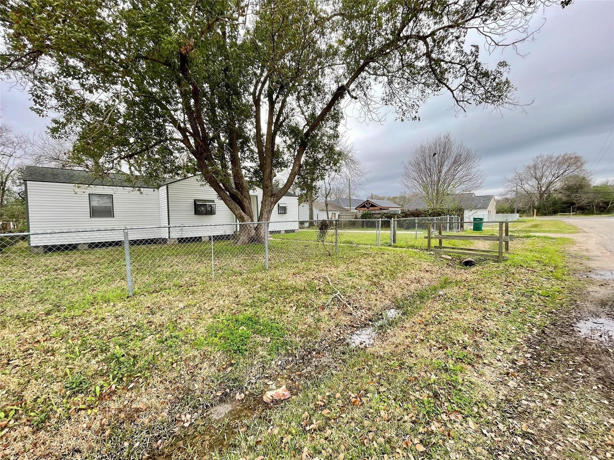 1827 Neuman La Marque, TX 77568 - Photo 21 of 24 a view of a house with a yard and sitting area