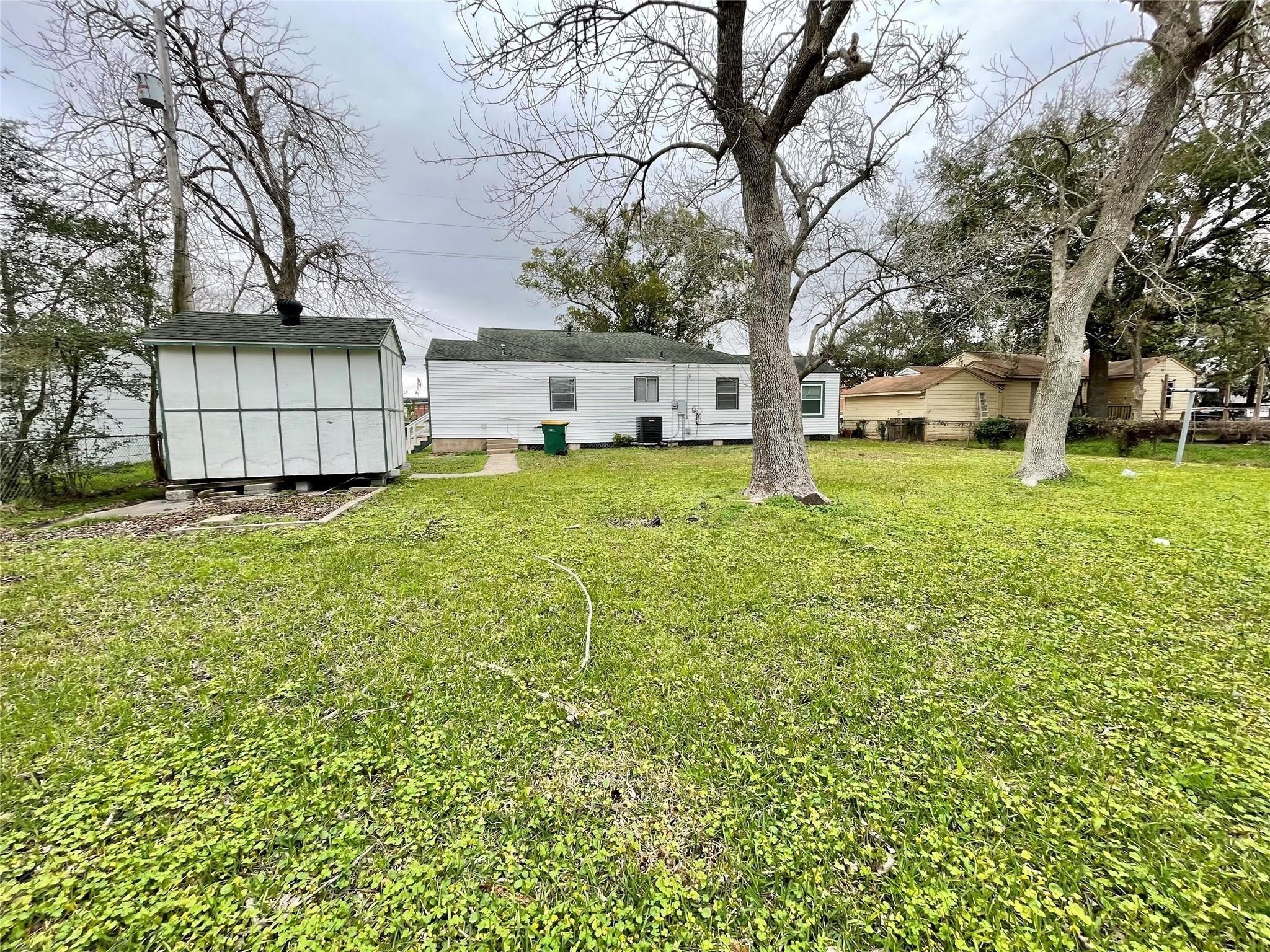 1827 Neuman La Marque, TX 77568 - Photo 22 of 24 a white house that has a tree in front of it