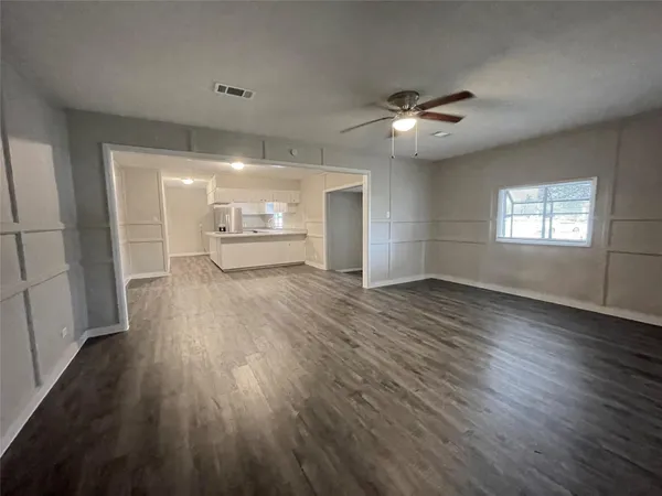 a view of a kitchen counter space with wooden floor