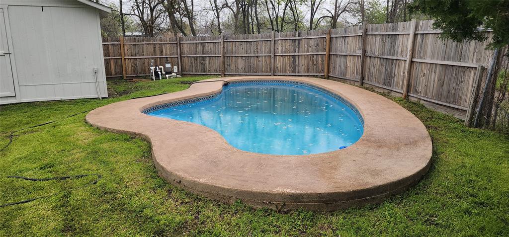 a view of a swimming pool with a chairs