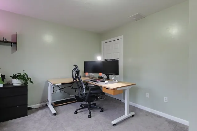 a view of a workspace with furniture