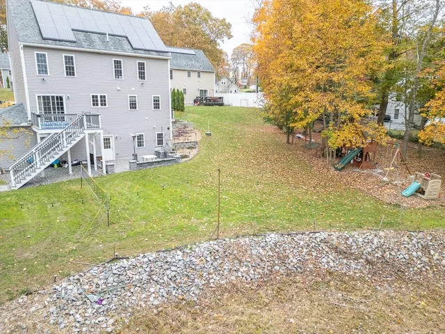 a view of a wooden wall with a dry yard