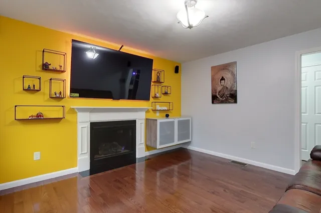 a living room with a flat screen tv