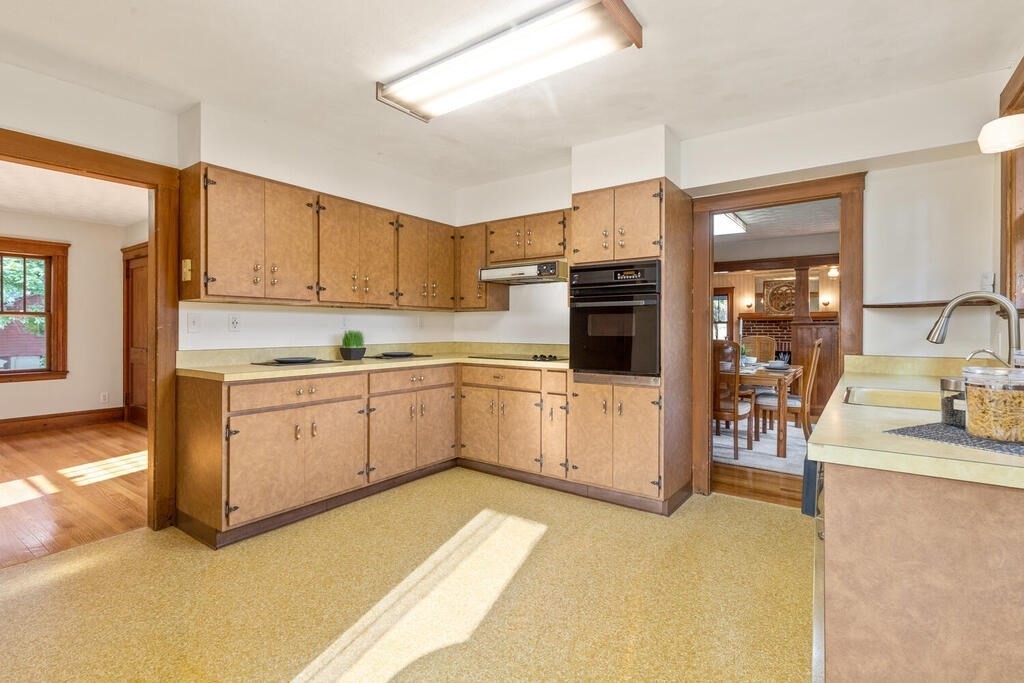 35 Brook Street Wakefield, MA 01880 - Photo 14 of 33 a kitchen with a sink stove and cabinets