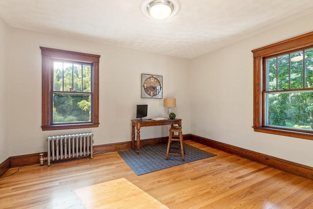 35 Brook Street Wakefield, MA 01880 - Photo 16 of 33 a living room with furniture and a window