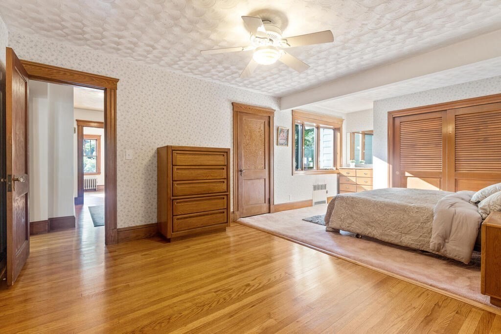 35 Brook Street Wakefield, MA 01880 - Photo 17 of 33 a spacious bedroom with a bed and wooden floor