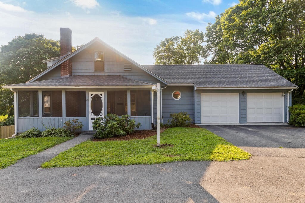 35 Brook Street Wakefield, MA 01880 - Photo 2 of 33 a front view of a house with a yard and garage