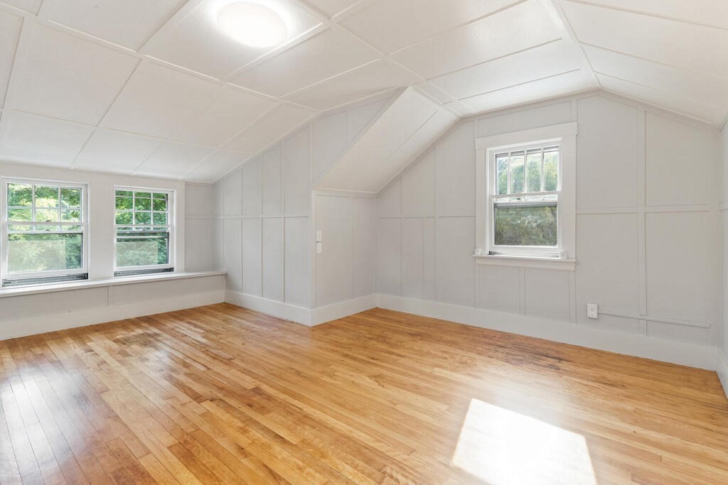 35 Brook Street Wakefield, MA 01880 - Photo 21 of 33 a view of an empty room with wooden floor and a window