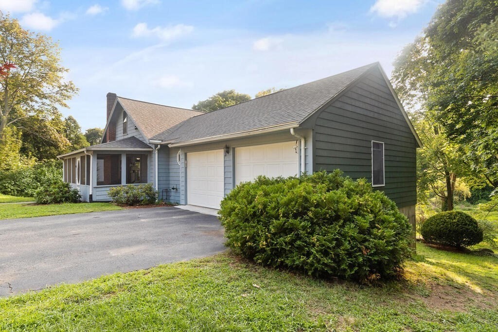 35 Brook Street Wakefield, MA 01880 - Photo 3 of 33 a front view of a house with garden