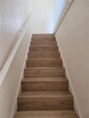 a view of an entryway with wooden floor