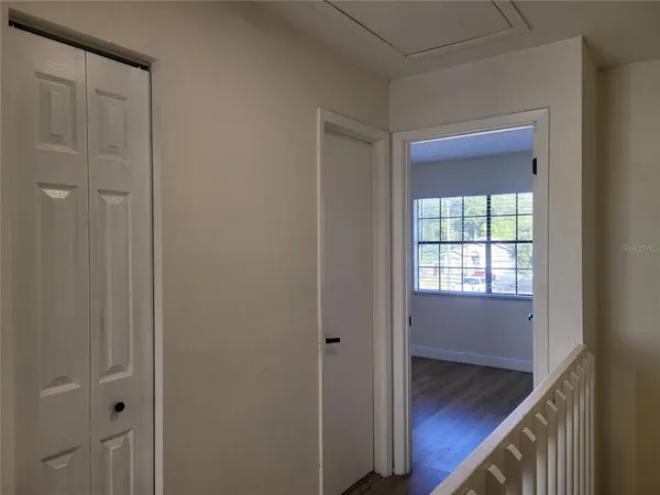 a bathroom with a toilet and a bath tub