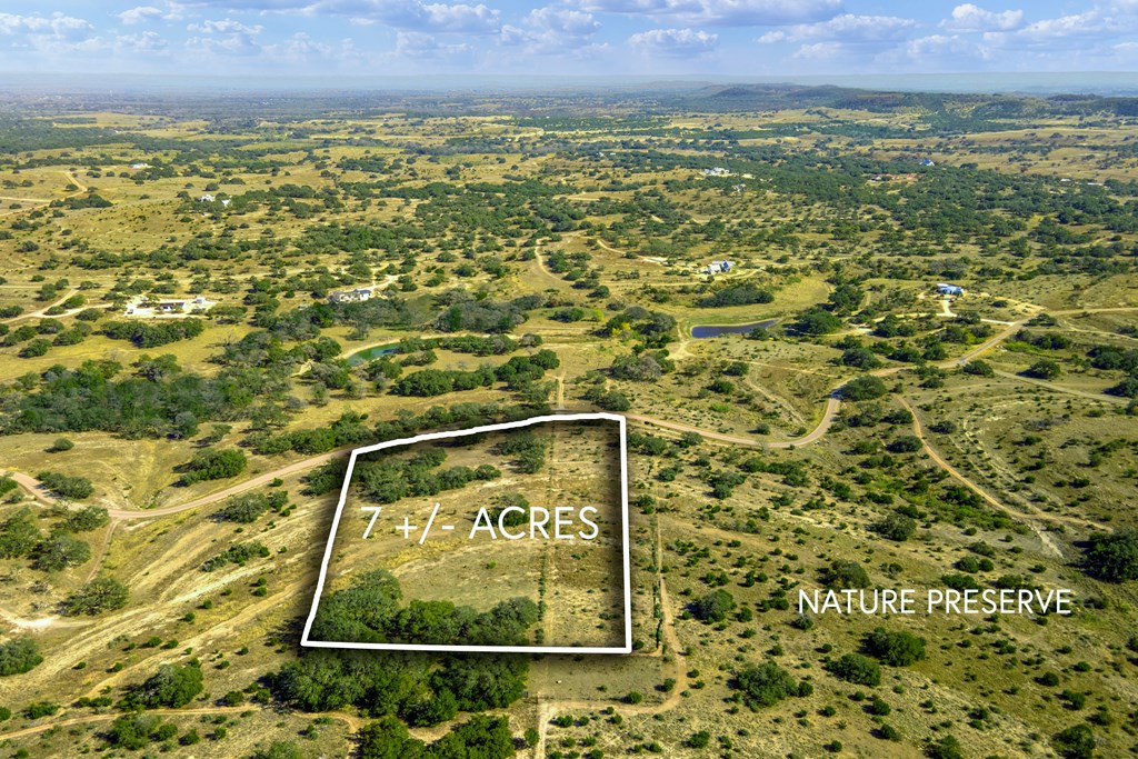 1365 North Walnut Springs Road, Unit 69 Johnson City, TX 78636 - Photo 39 of 41 a sign that is sitting on a brick wall