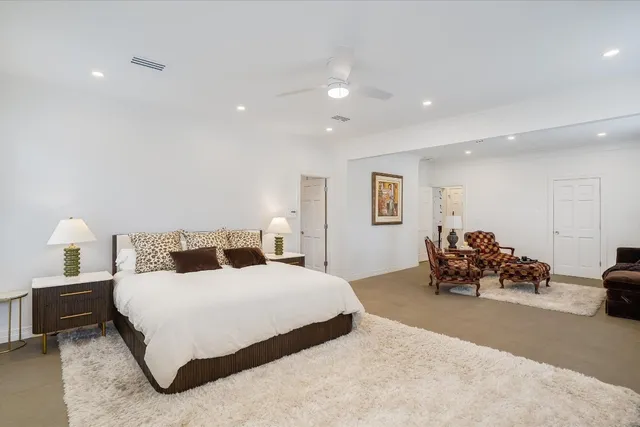 a bedroom with a bed and a couch