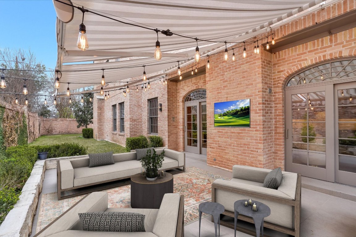 3705 Gilbert Street, Unit B Austin, TX 78703 - Photo 29 of 35 a view of a patio with couches chairs and wooden floor