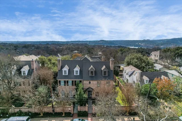 an aerial view of a house with a garden