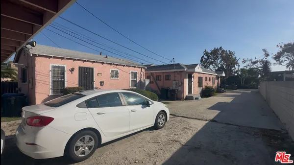 a view of a car parked in front of a house