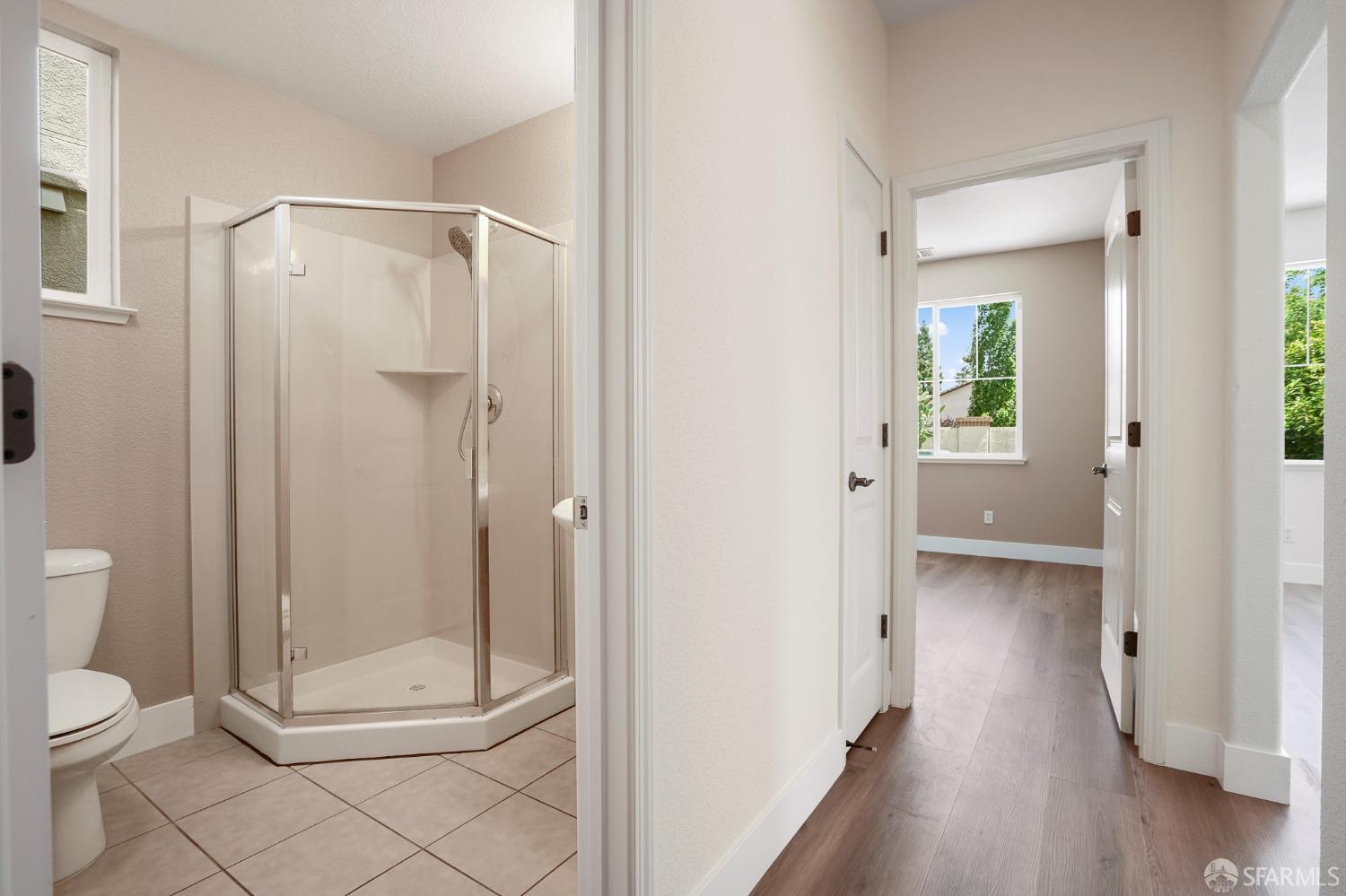 5290 Sungrove Way Antioch, CA 94531 - Photo 16 of 47 a bathroom with a glass shower door
