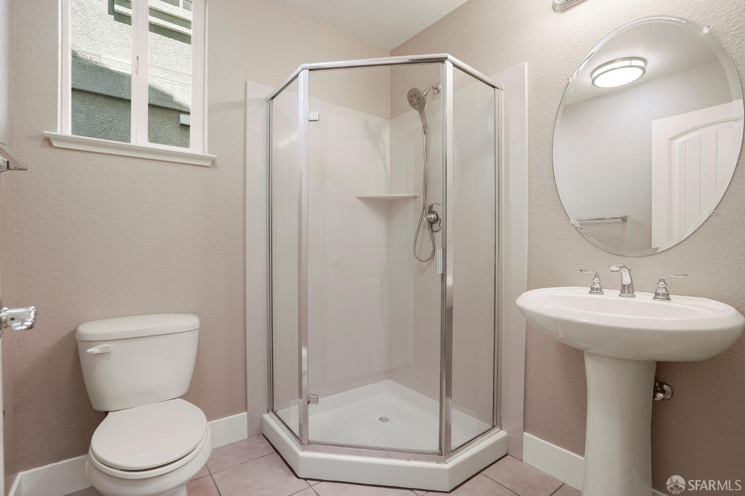 5290 Sungrove Way Antioch, CA 94531 - Photo 17 of 47 a bathroom with a toilet sink and shower