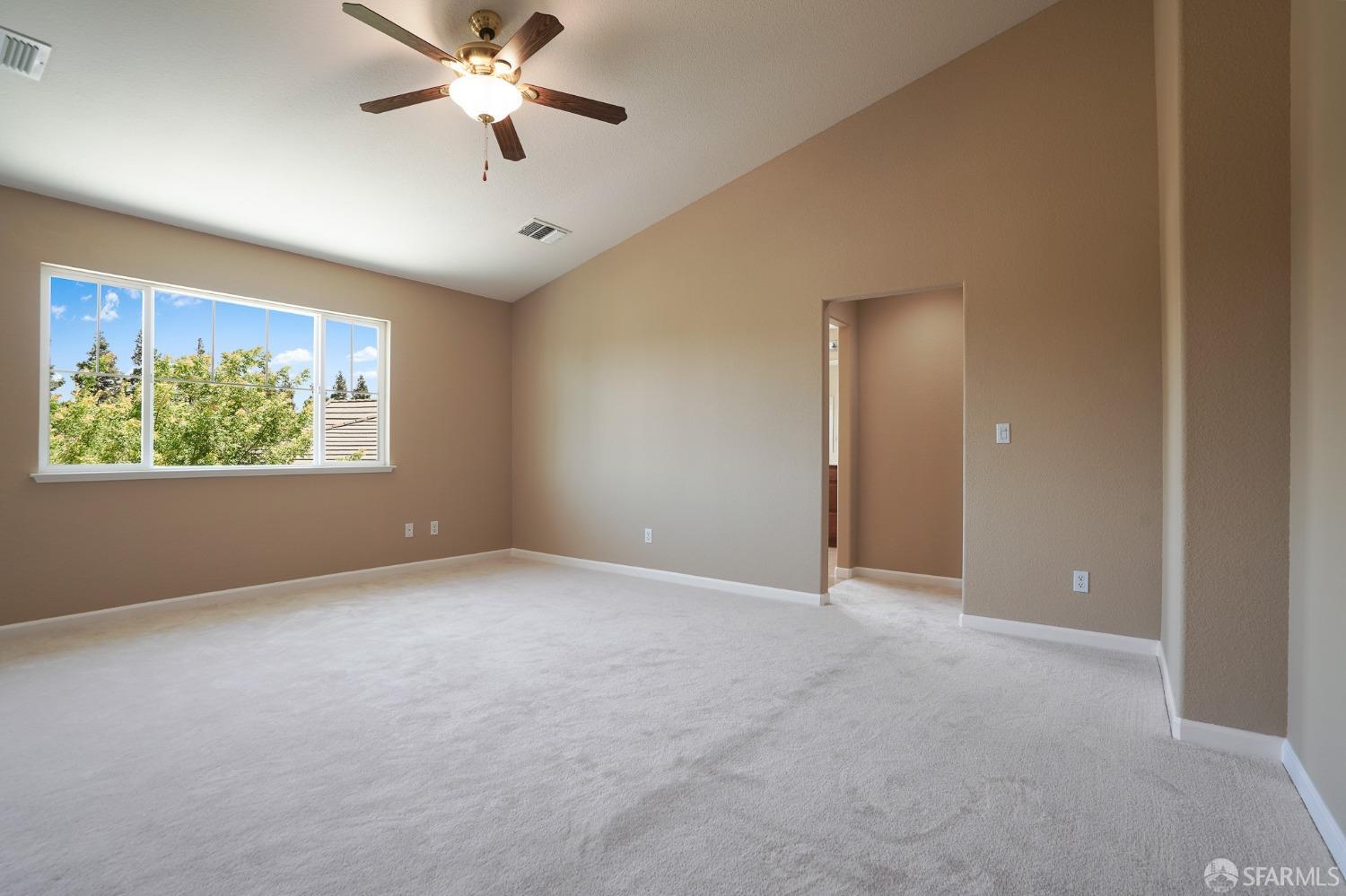 5290 Sungrove Way Antioch, CA 94531 - Photo 29 of 47 an empty room with windows and fan