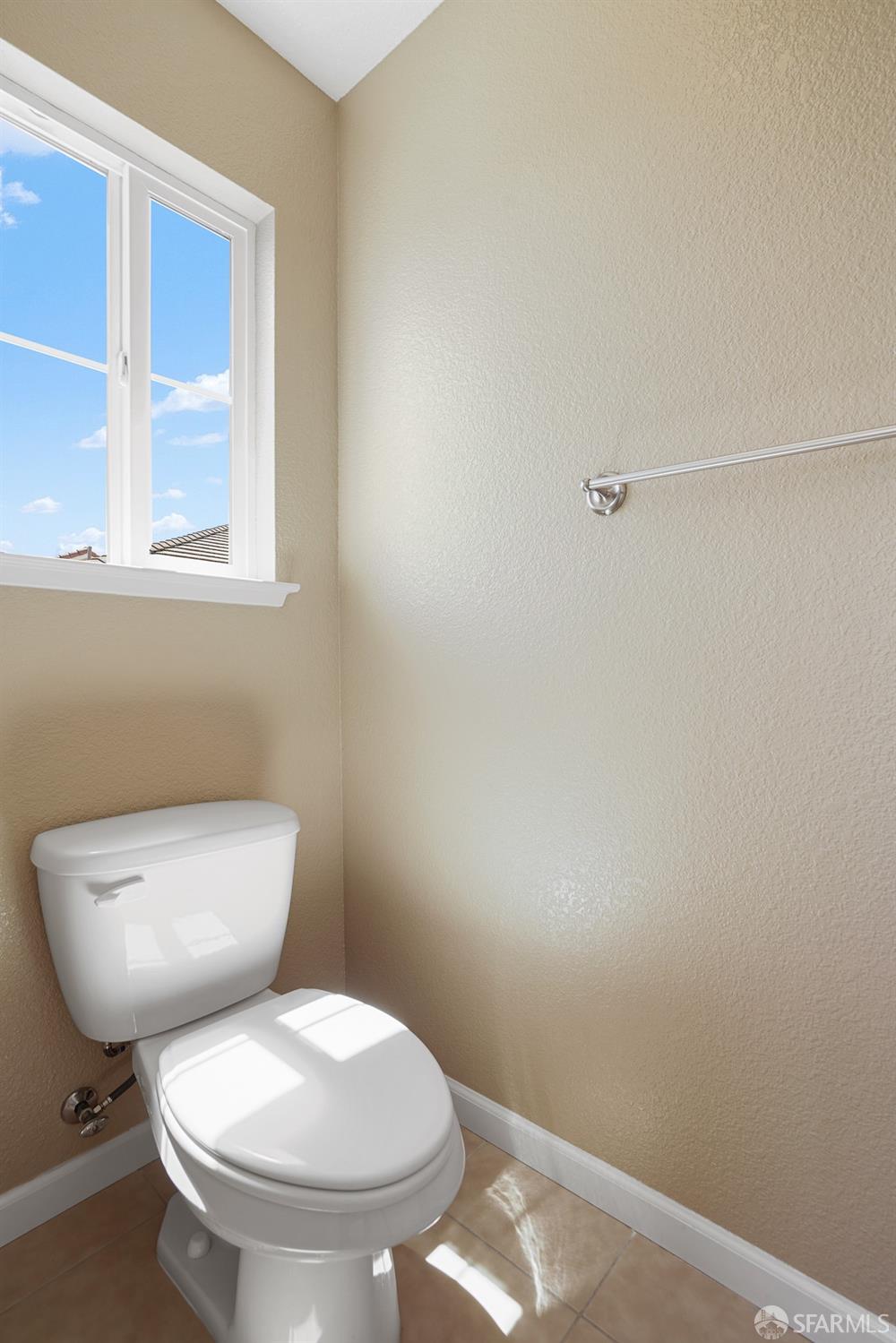 5290 Sungrove Way Antioch, CA 94531 - Photo 34 of 47 a white toilet sitting next to a bathroom sink