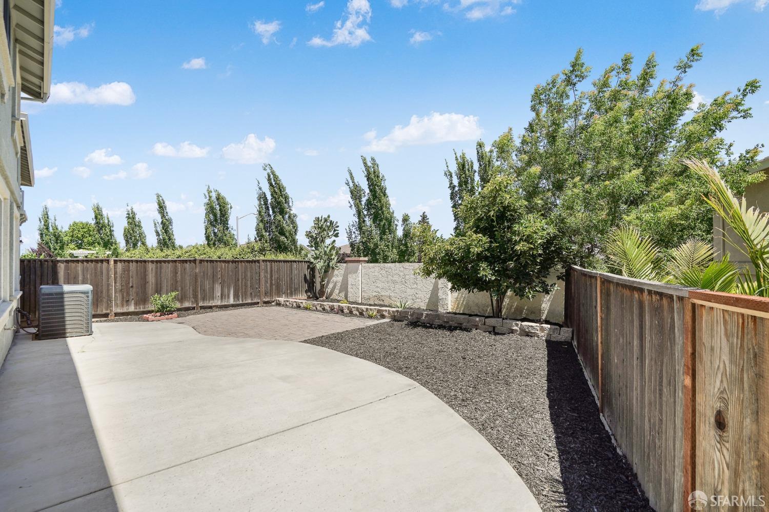 5290 Sungrove Way Antioch, CA 94531 - Photo 44 of 47 a row of trees with wooden fence