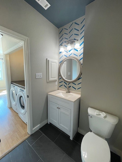 7501 Shadowridge Run, Unit 135 Austin, TX 78749 - Photo 18 of 23 a bathroom with a toilet a sink and mirror