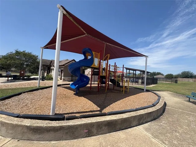 a view of swimming pool with sitting area