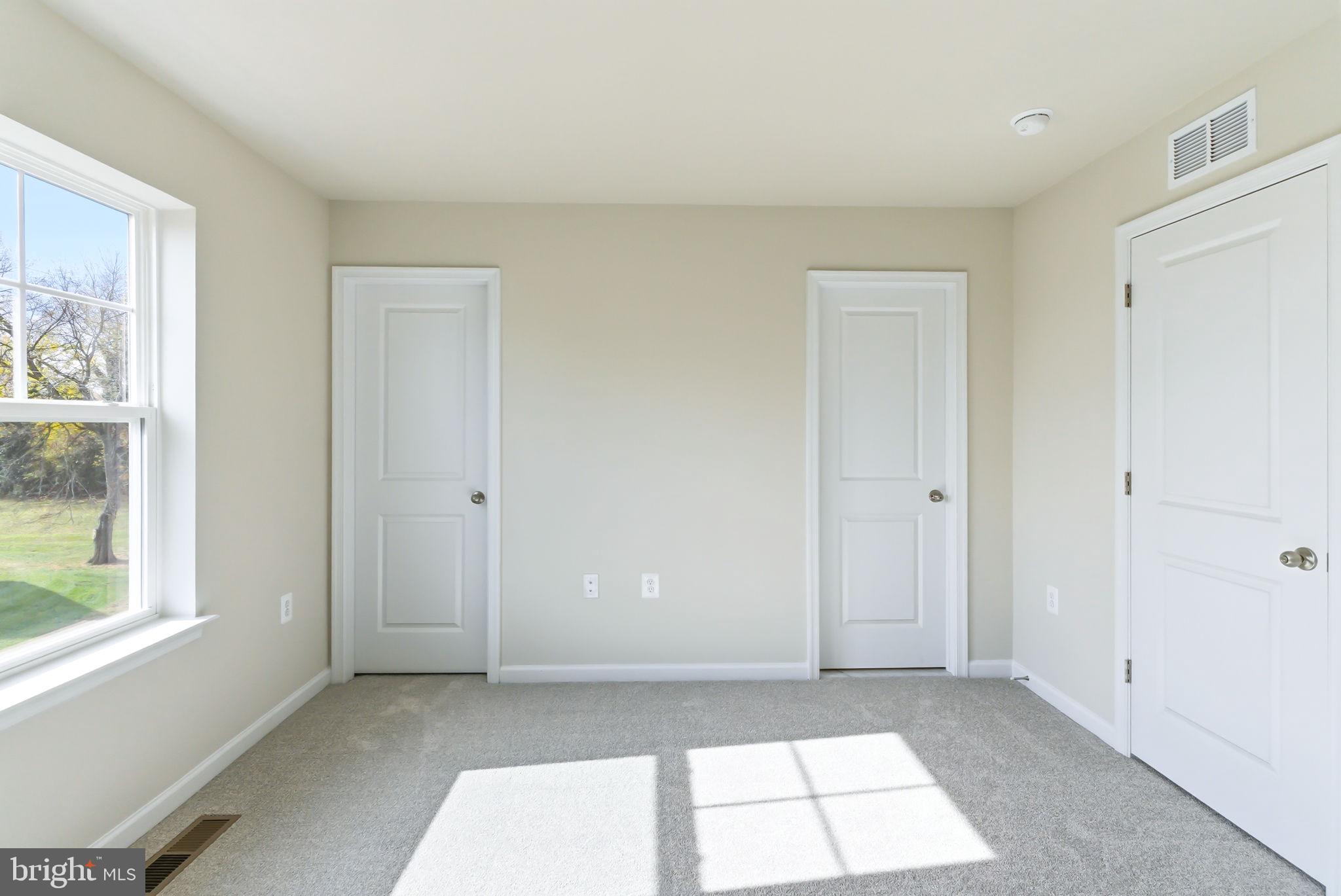 209 Monteith Drive Winchester, VA 22601 - Photo 12 of 29 a view of empty room with window and ceiling fan