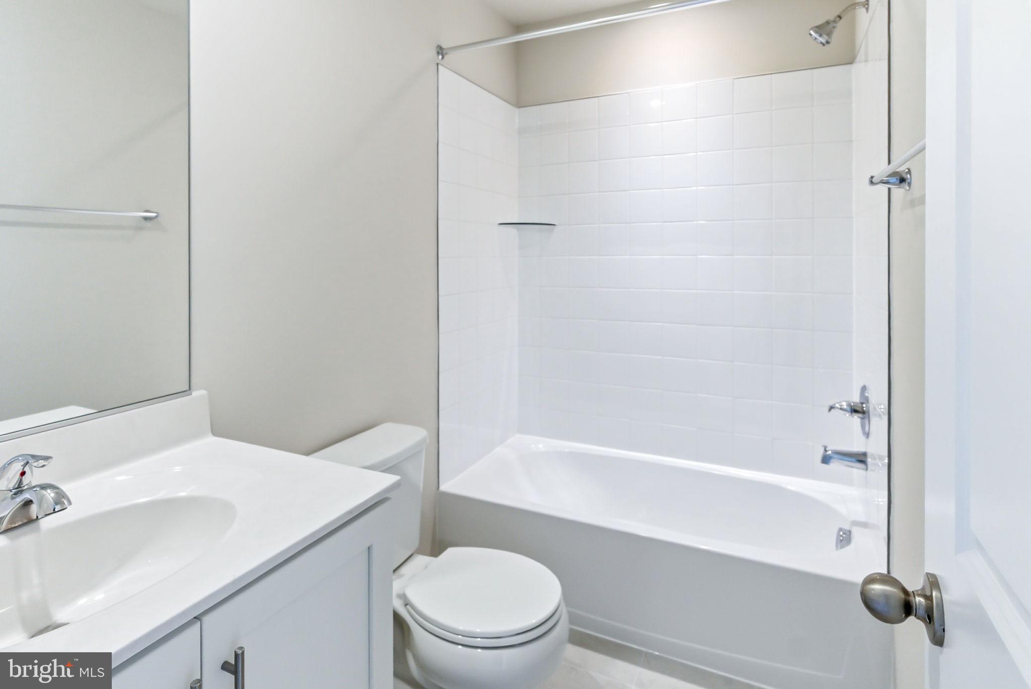 209 Monteith Drive Winchester, VA 22601 - Photo 19 of 29 a bathroom with a sink a toilet and shower