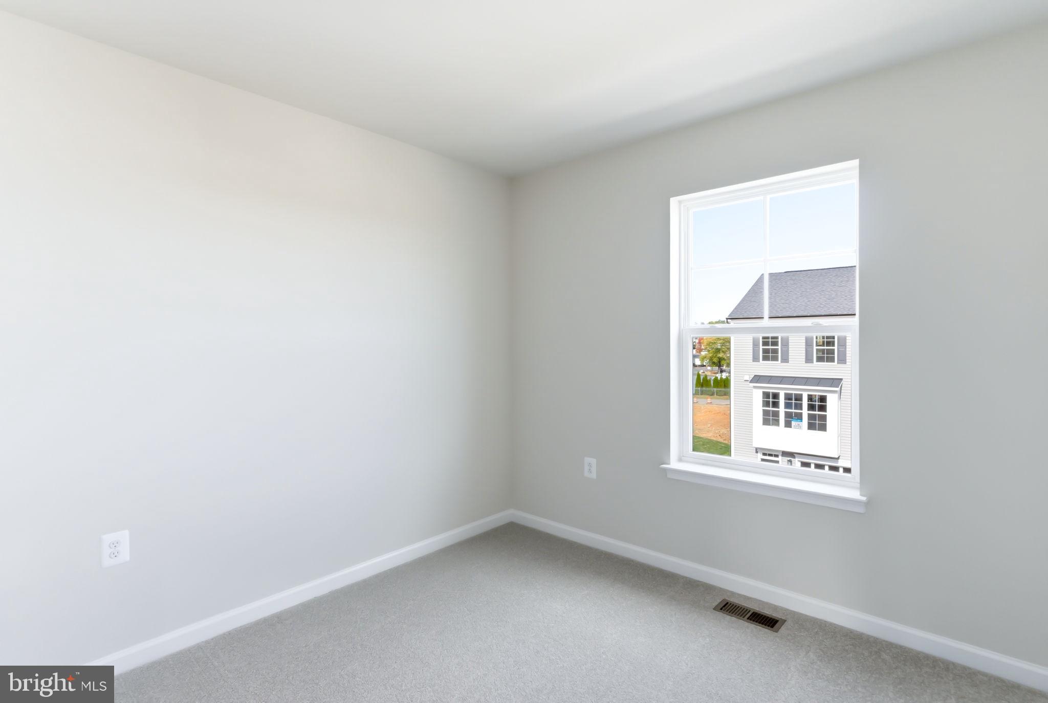 209 Monteith Drive Winchester, VA 22601 - Photo 21 of 29 an empty room with a window