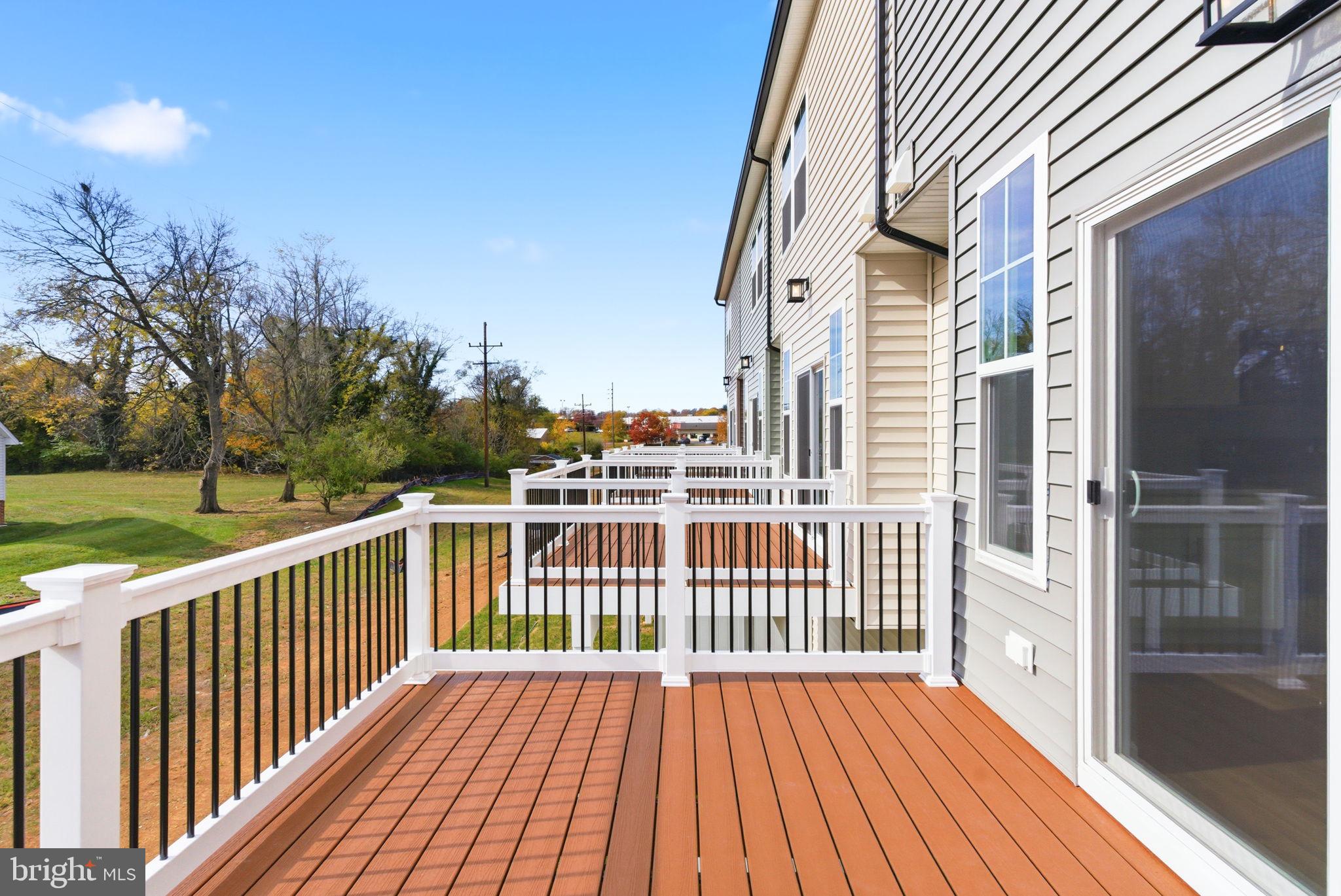 209 Monteith Drive Winchester, VA 22601 - Photo 25 of 29 a view of a wooden deck with a yard
