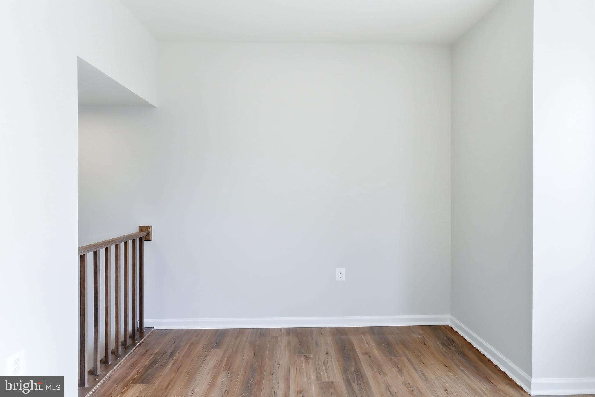 209 Monteith Drive Winchester, VA 22601 - Photo 7 of 29 a view of a hallway with wooden floor
