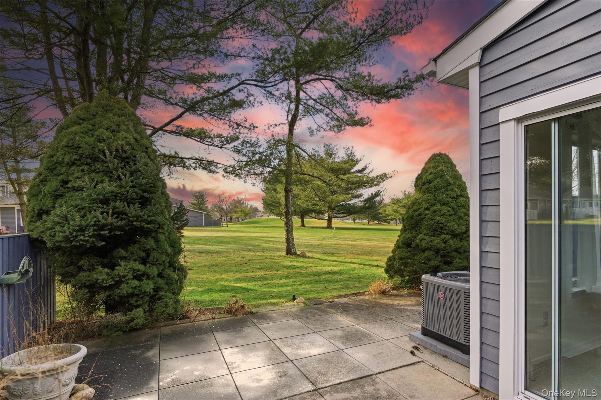 763 Spring Lake Drive Middle Island, NY 11953 - Photo 16 of 31 a view of a backyard with plants and a patio
