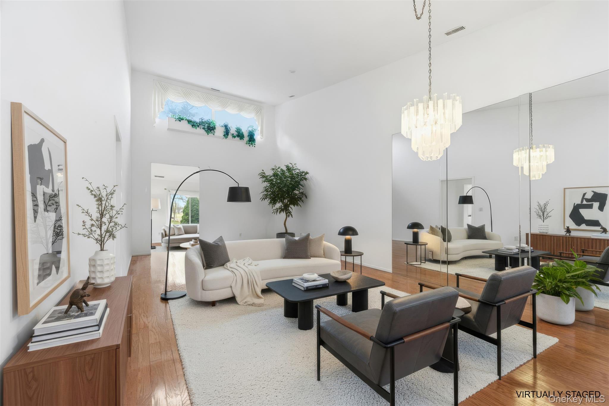 763 Spring Lake Drive Middle Island, NY 11953 - Photo 2 of 31 a living room with furniture chandelier and view of kitchen