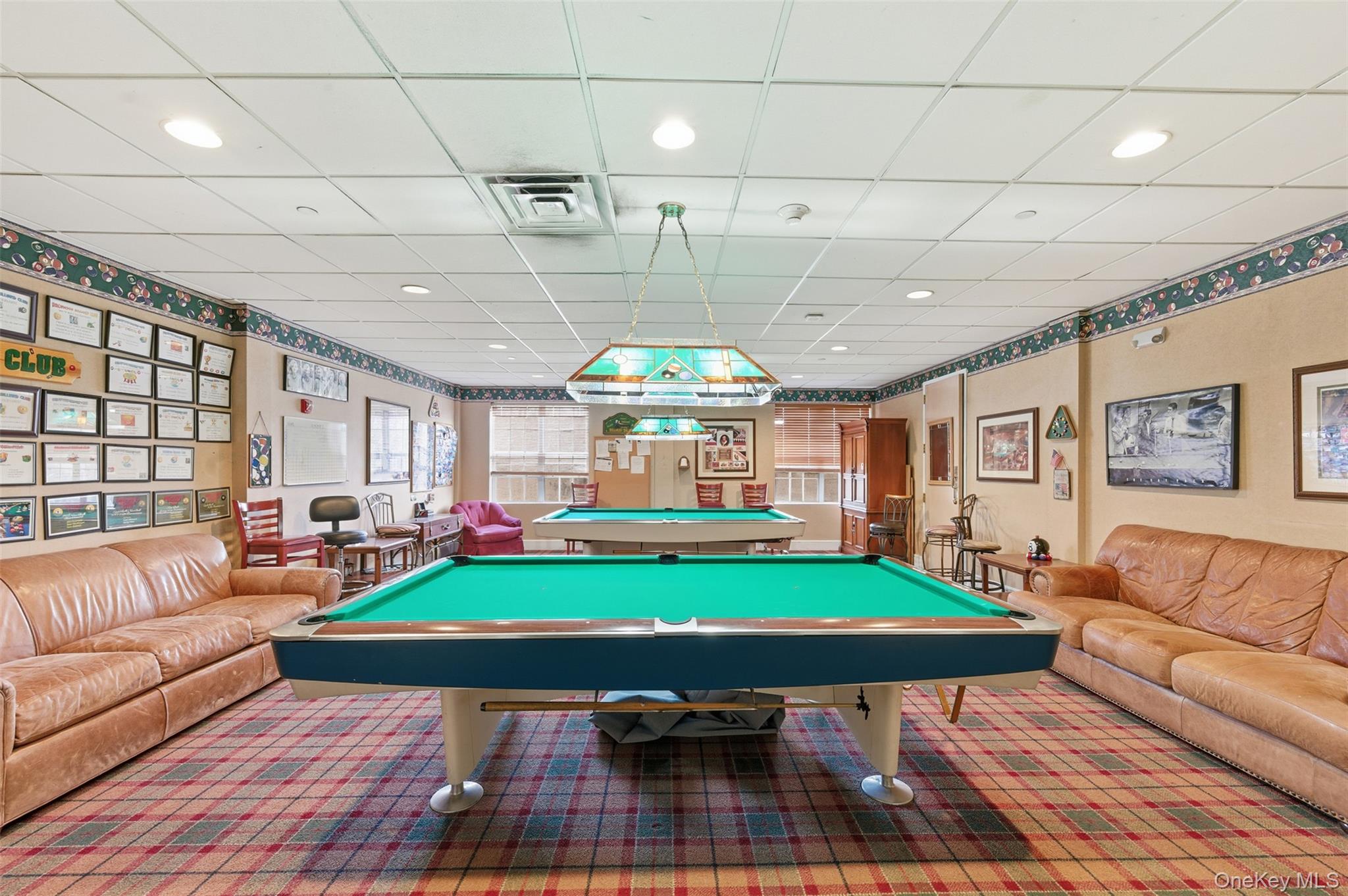763 Spring Lake Drive Middle Island, NY 11953 - Photo 23 of 31 a living room with furniture a swimming pool and a large window
