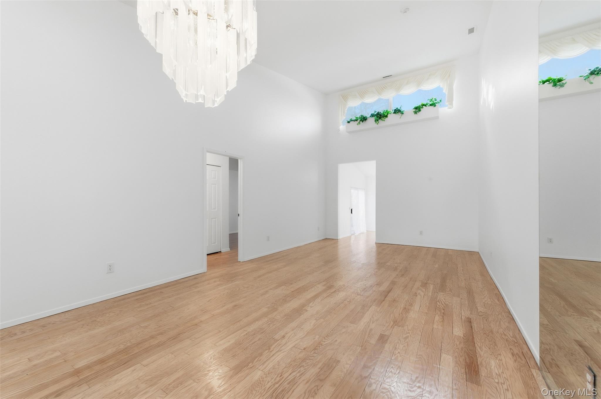 763 Spring Lake Drive Middle Island, NY 11953 - Photo 25 of 31 a view of empty room with wooden floor