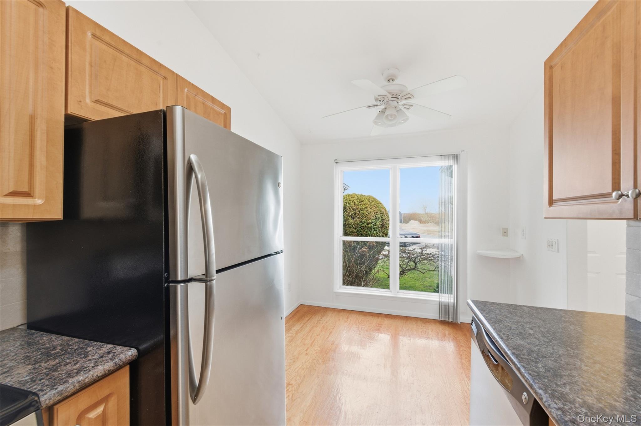 763 Spring Lake Drive Middle Island, NY 11953 - Photo 5 of 31 a kitchen with stainless steel appliances granite countertop a refrigerator a oven and a sink with granite countertops