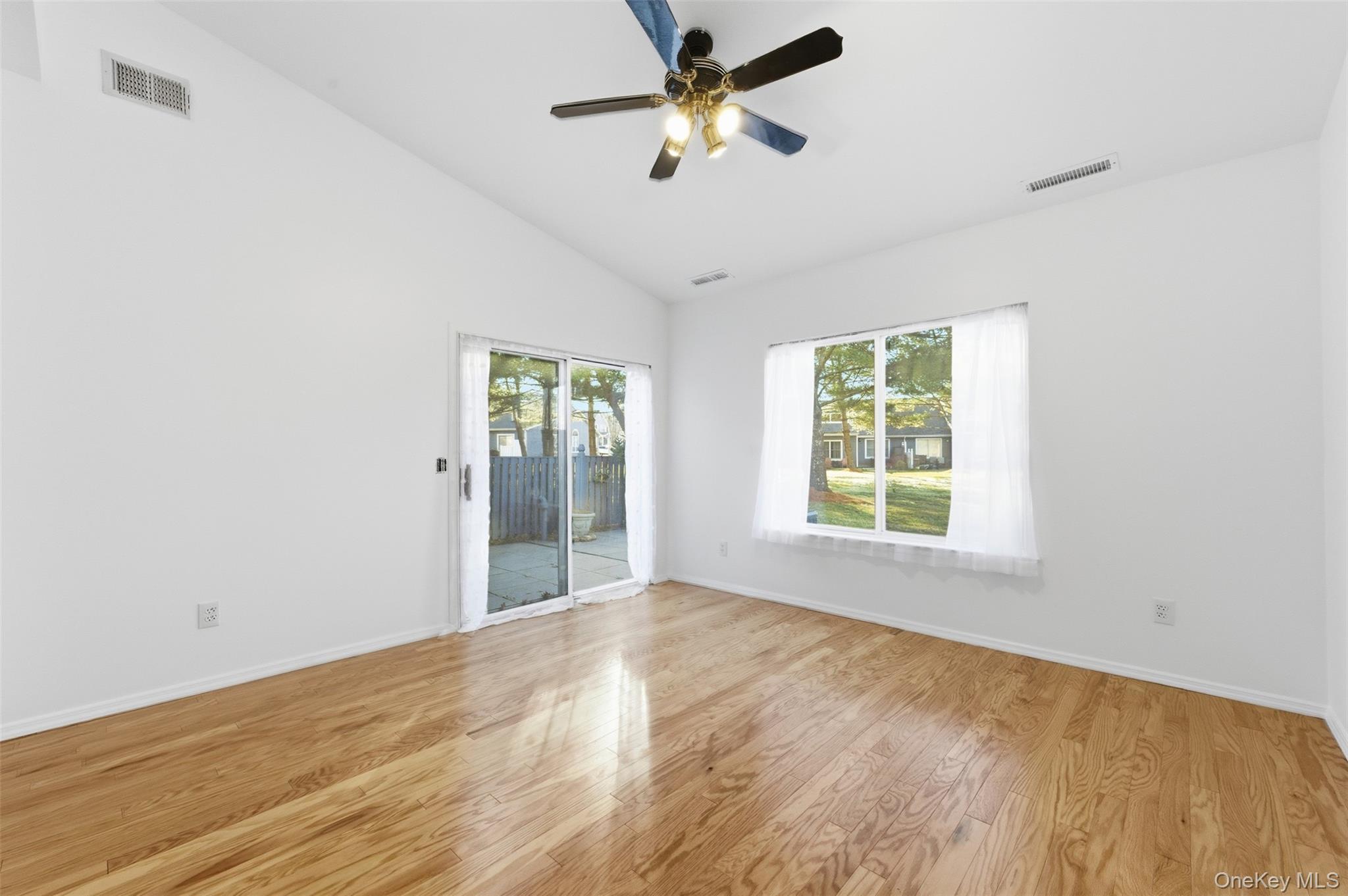 763 Spring Lake Drive Middle Island, NY 11953 - Photo 7 of 31 a view of an empty room with a window