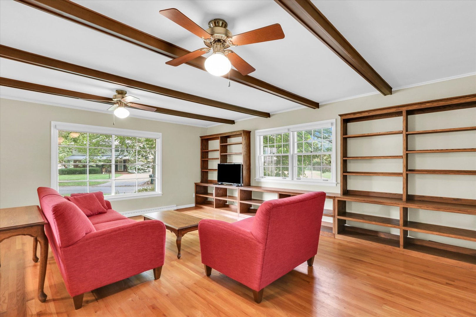 1202 Foothill Drive Champaign, IL 61821 - Photo 16 of 53 a living room with furniture a large window and wooden floor