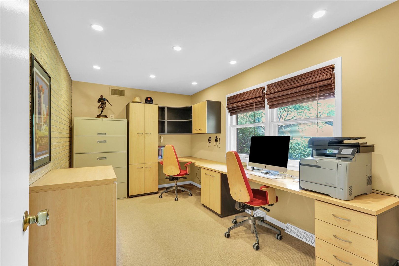 1202 Foothill Drive Champaign, IL 61821 - Photo 23 of 53 a view of a workspace with furniture and a flat screen tv