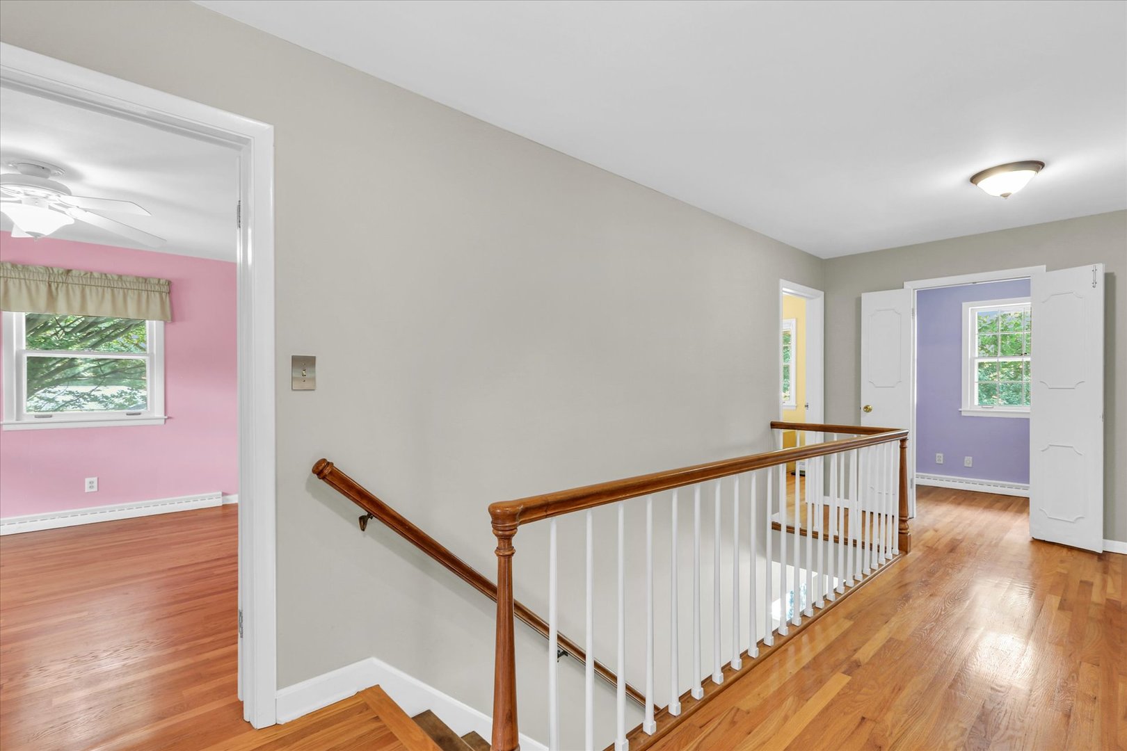 1202 Foothill Drive Champaign, IL 61821 - Photo 31 of 53 a view of a hallway with wooden floor and windows