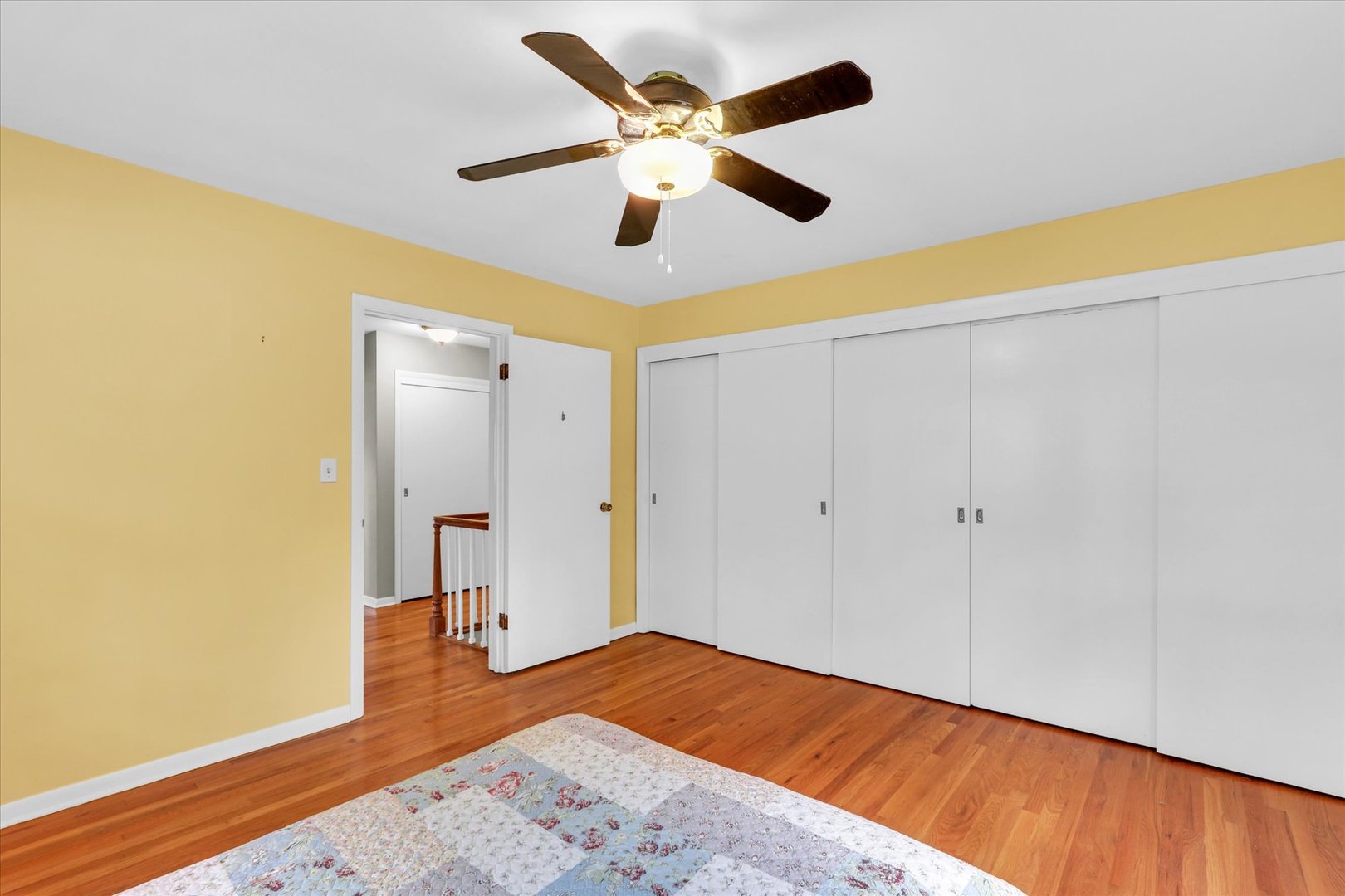 1202 Foothill Drive Champaign, IL 61821 - Photo 33 of 53 a bedroom with a bed and a ceiling fan