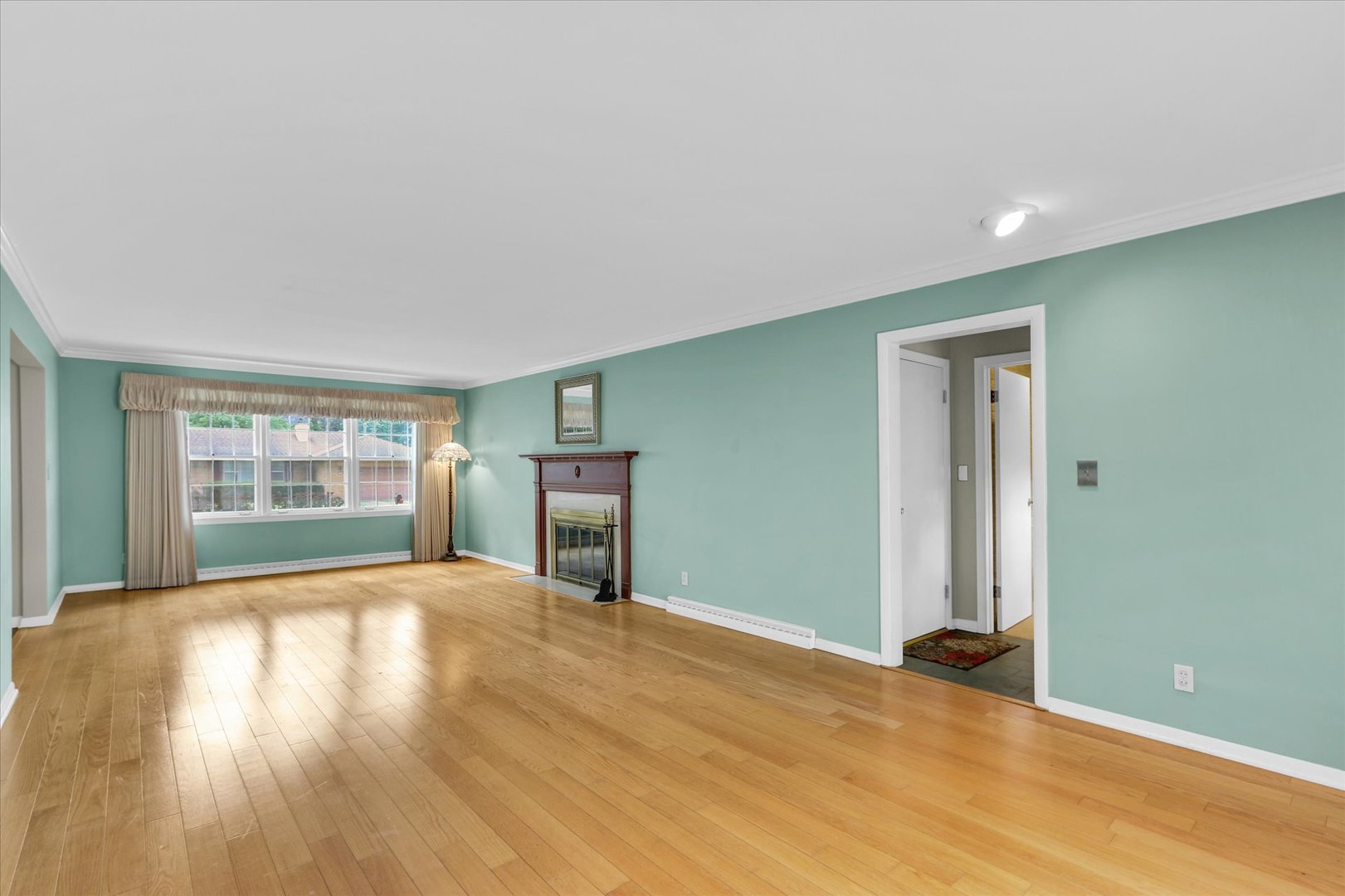 1202 Foothill Drive Champaign, IL 61821 - Photo 9 of 53 a view of an empty room with wooden floor and a window