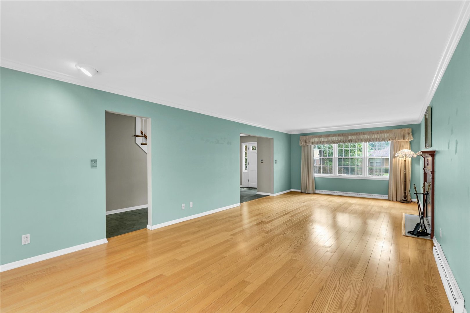 1202 Foothill Drive Champaign, IL 61821 - Photo 10 of 53 a view of an empty room with wooden floor and a window