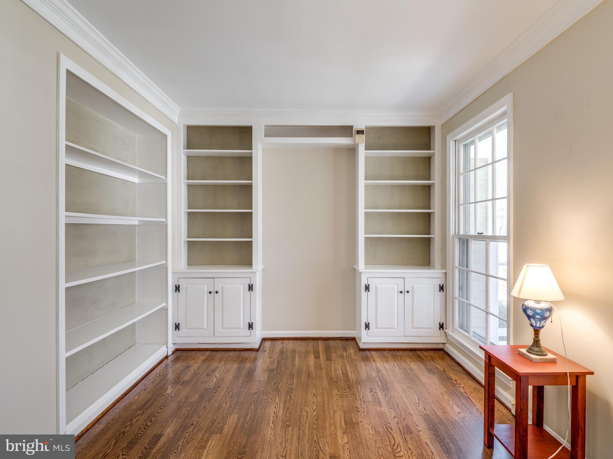 1591 Stowe Road Reston, VA 20194 - Photo 4 of 30 a view of an empty room with a window and wooden floor