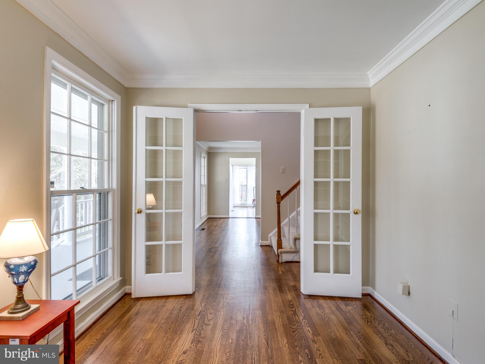 1591 Stowe Road Reston, VA 20194 - Photo 5 of 30 an empty room with wooden floor and windows