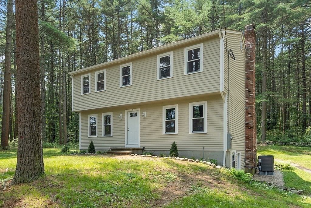 43 R Beaver Brook Road Westford, MA 01886 - Photo 1 of 42 a front view of a house with yard and trees
