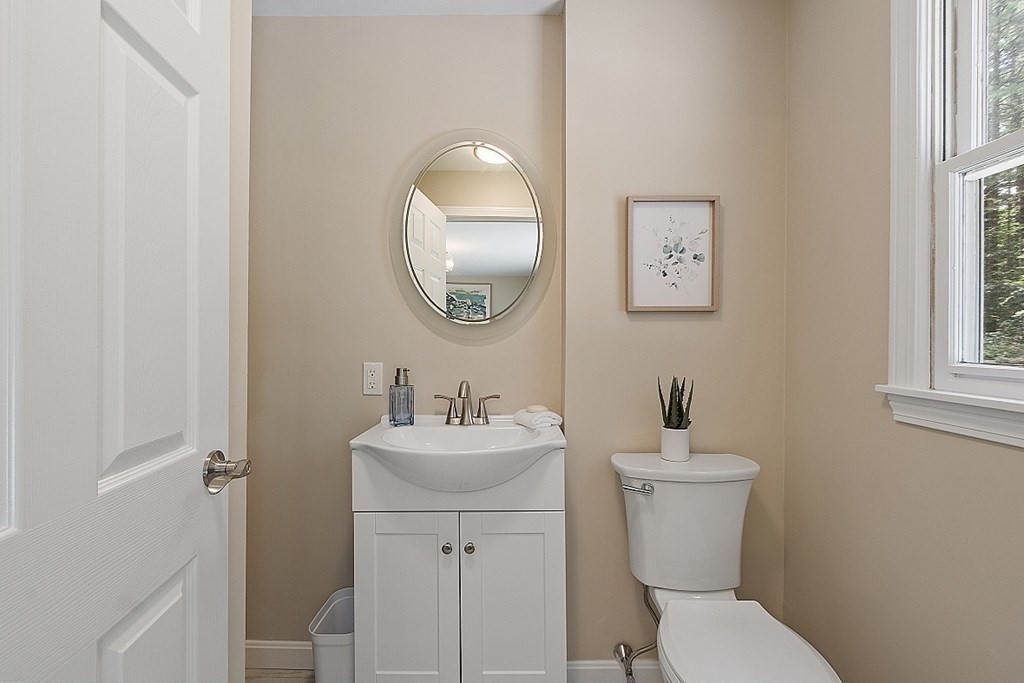 43 R Beaver Brook Road Westford, MA 01886 - Photo 13 of 42 a bathroom with a toilet a sink and mirror